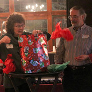 Vi Pratt tosses the wrapping paper helter-skelter to see what's inside
